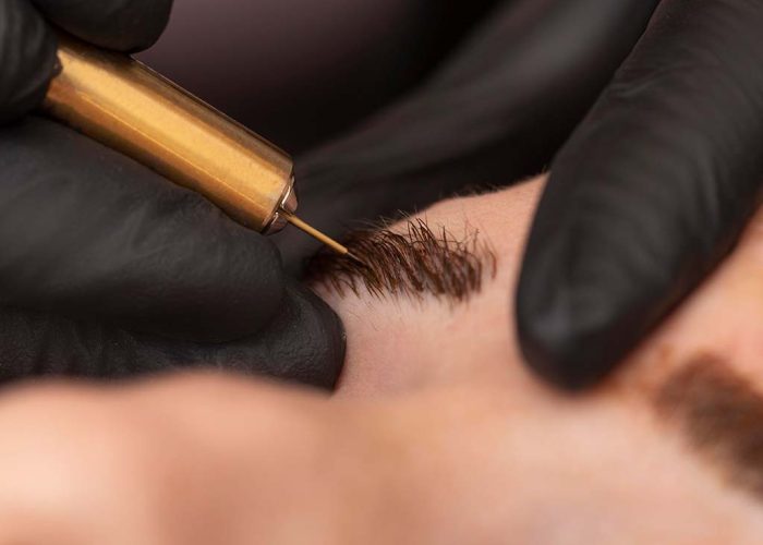 female-going-through-microblading-treatment female-going-through-microblading-treatment